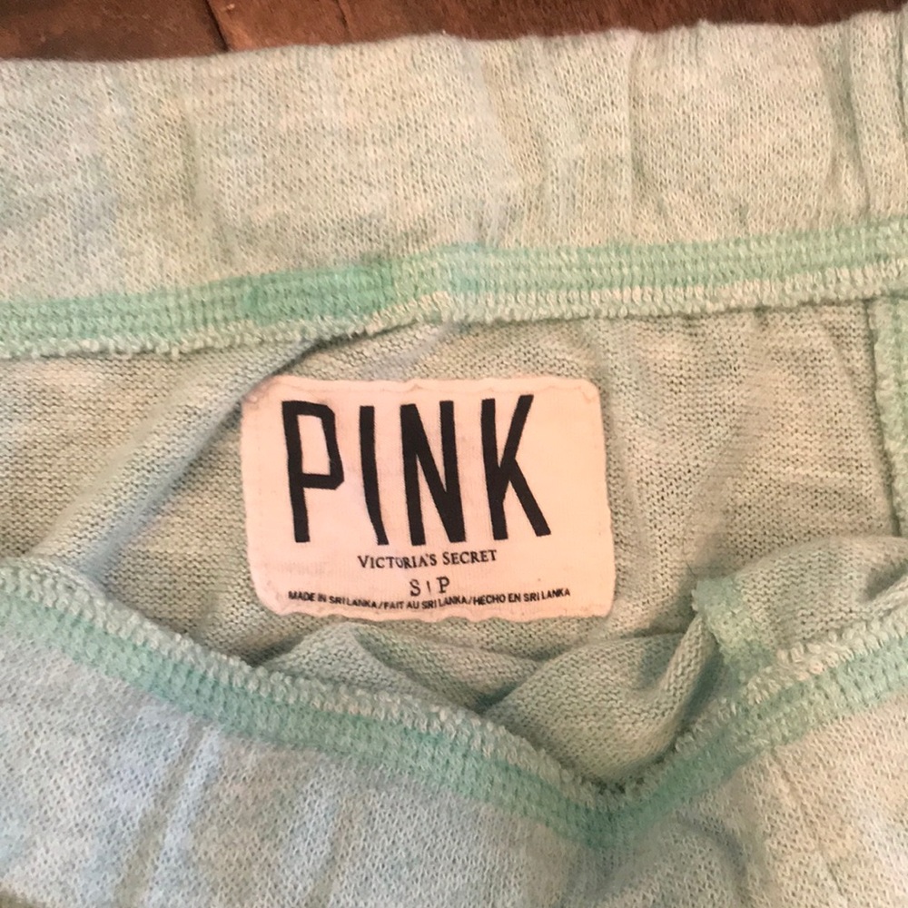 Mint green VS Pink sweatpants.